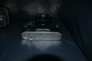 vintage Canon AV - 1 film camera with Canon FD 50mm 1:1.  8 lens & Minolta Flash 2