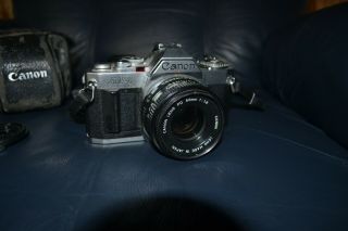 vintage Canon AV - 1 film camera with Canon FD 50mm 1:1.  8 lens & Minolta Flash 3