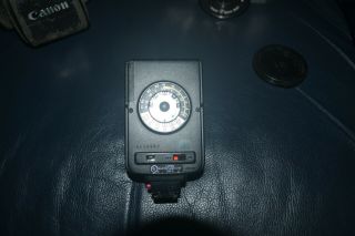 vintage Canon AV - 1 film camera with Canon FD 50mm 1:1.  8 lens & Minolta Flash 5