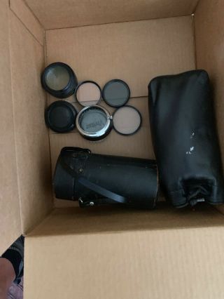 Assorted Camera Lenses And Other Equipment