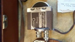 Movie camera and accessories.  Revere 8 Model 67.  Film and light meter 5