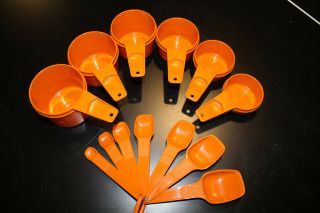 Vintage Tupperware Measuring Cups And Measuring Spoons In Orange