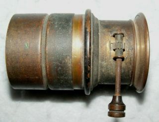 An old,  unbranded,  small brass lens with rack and pinion focusing 2