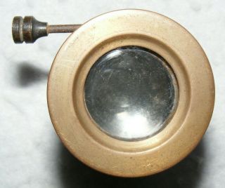 An old,  unbranded,  small brass lens with rack and pinion focusing 4