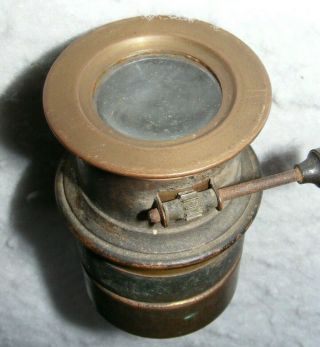 An old,  unbranded,  small brass lens with rack and pinion focusing 5