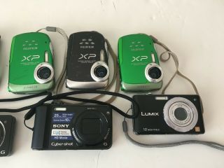 9 Digital Cameras.  Sony,  FujiFilm,  Samsung,  Hp,  and Panasonic. 2