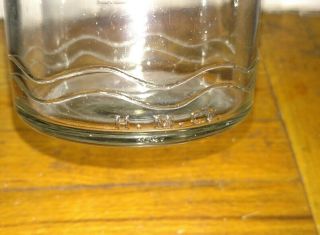 Vintage oil 1 quart glass bottle H.  M co with tin metal spout 4