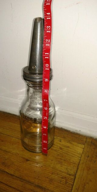 Vintage oil 1 quart glass bottle H.  M co with tin metal spout 6