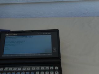 Hewlett Packard 100LX Palmtop PC/1MB Ram W/ Booklet Turns On/Off 8
