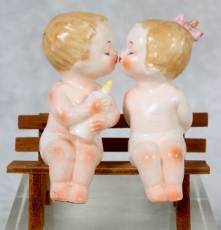 Vintage Inarco Kissing Boy & Girl Babies Sitting On Bench Salt & Pepper Shakers