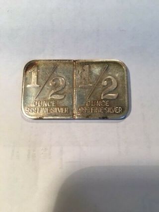 Vintage International Trade Unit Silver 1 oz art bar 1/2 oz fractional back.  999 2