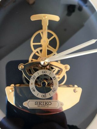 Vintage SEIKO Oval skeleton Gold finish Quartz Wall Clock Model QAX201G. 2