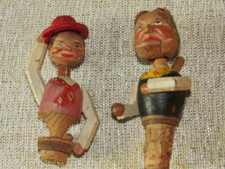 Two Vintage Anri Hand Carved Mechanical Wine Stoppers Old Woman Man Tipping Hat