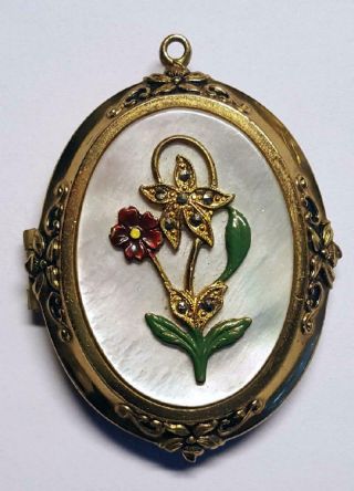 Vintage Decorative Gold - Toned Locket With Enamel Flower On Top Of Mop Background