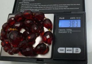 VINTAGE BAKELITE CHERRY RED AMBER FACETED GRADUATING BEAD NECKLACE 38.  3 GRAMS. 7