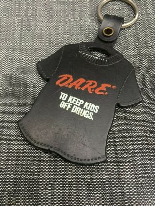 Vintage 1990s D.  A.  R.  E T - Shirt Keychain Dare To Keep Kids Off Drugs Memorabilia
