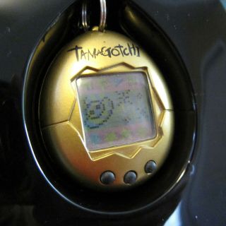 Vintage 1997 Tamagotchi Gold Egg Bandai Virtual Reality Pet Toy 4