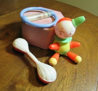 Three Vintage Hard Plastic Baby Rattle Toys For Display