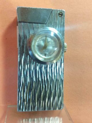 Vintage Swiss Lift Arm Petrol Lighter With A Built In Watch