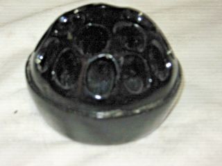 A Vintage Black Glass Round 4 