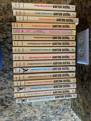 16 Trixie Belden Paperback Books.  2,  3,  4,  8,  9,  10,  12,  14,  15,  16,  17,  18,  21,  22,  26,  30
