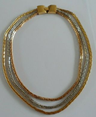 Vintage Triple Strand Trifari Necklace In Gold And Silver Coloured Metals.