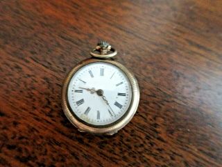 Lady ' s Antique French Gold Pocket Watch Roman Numerals Flower/Scroll Medallion 2