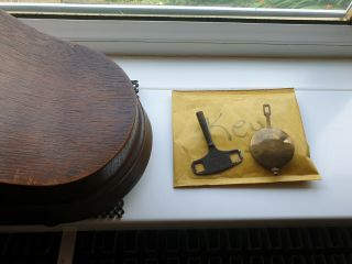 large vintage german d.  r.  g.  m.  wooden chiming mantel clock with key & pendulum. 5