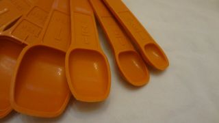 Set of 7 TUPPERWARE Vintage Orange Nesting Measuring Spoons & Ring Holder 5