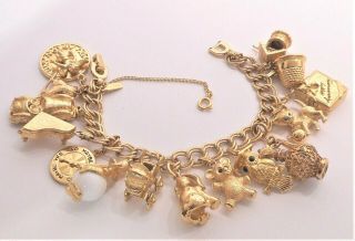 Vntg Monet Gold Plate Charm Bracelet Loaded With 15 Charms & Safety Chain 7.  5