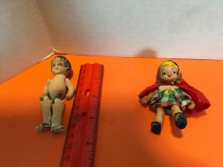 2 Vintage Doll House Dolls,  1 Bisque Jointed,  1 Rubber Lil Red Riding Hood