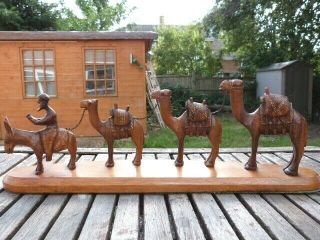 Lovely Vintage Hand Carved Wooden Figurines Of A Camel Train.