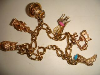 Vintage Gold Tone Signed Avon Charm Bracelet With Six Charms