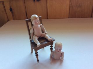 Two Antique All Bisque German Dolls