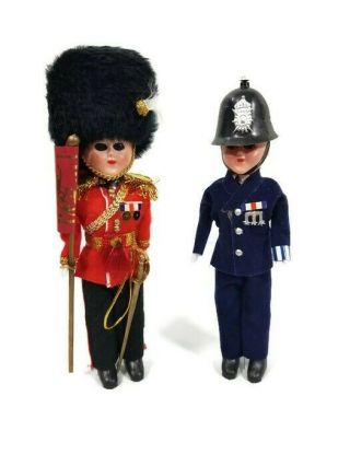 2 Vintage British Guardsman Police Sleepy Eye Plastic Dolls