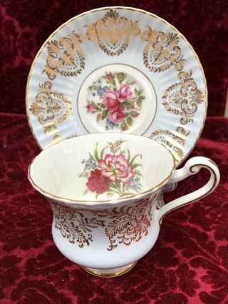 Vintage Paragon Tea Cup And Saucer Gold Chintz On Blue Floral Center England