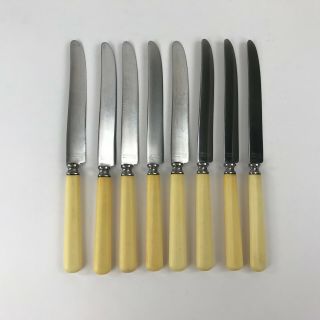 Vintage Universal Stainless Steel Knives Set Of 8 Butterscotch Bakelite Handles