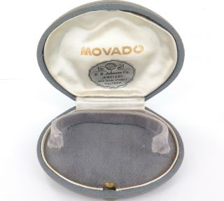 . A Good Vintage Movado Ladies Watch Clam Shaped Display Case.