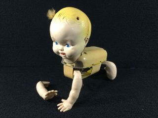 Vintage Celluloid & Tin Mechanical Crawling Baby Wind Up Toy.  Detached Arm