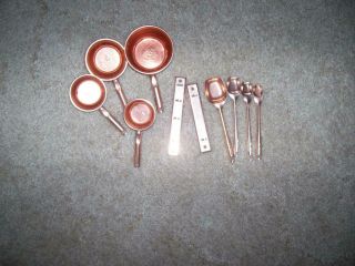 Set Of Vintage Copper Or Copper Colored Measuring Cups And Spoons With Racks
