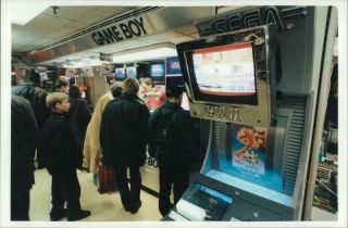 People Standing In Front Of Gameboy Store.  - Vintage Photo
