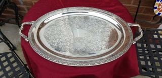 A Large Vintage Silver Plated Serving Tray With Embossed Patterns.