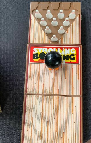 Vintage 1980 ' s strolling bowling game.  A Little Portable Bowling Alley.  Tomy Toy 4