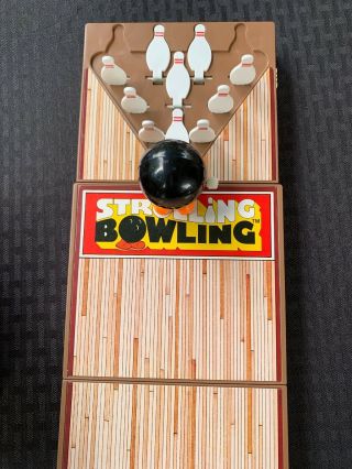 Vintage 1980 ' s strolling bowling game.  A Little Portable Bowling Alley.  Tomy Toy 5