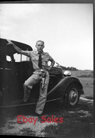 T7 - A Vintage Photo Negative - Man Standing By A Car