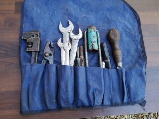 A Vintage Car Tool Roll And Tools