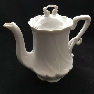 Vintage White Porcelain Teapot With Scroll Handle And A Lid