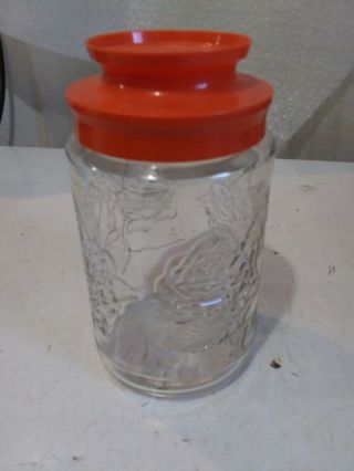 Vintage Anchor Hocking Glass Jar With Orange Lid Embossed Roses 2