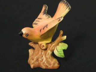 Vintage Japan Pale Yellow Pink And Black Trimmed Perched Bird In Flight Figurine