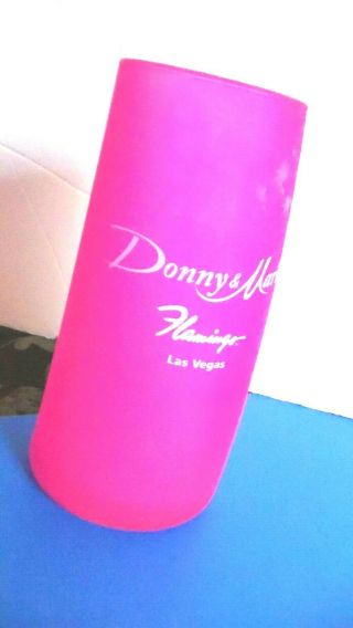 Donny & Marie Osmond Flamingo Las Vegas Pink Curved Tall Drink Glass.  Vintage 2